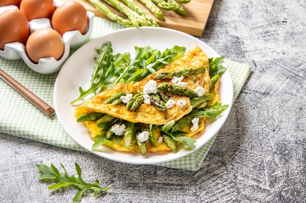 Gourmet Tasty Egg Omelette with Asparagus and soft Cheese Asparagus Fresh Asparagus with eggs