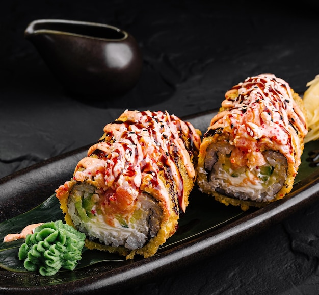 Gourmet tempura sushi roll with spicy sauce