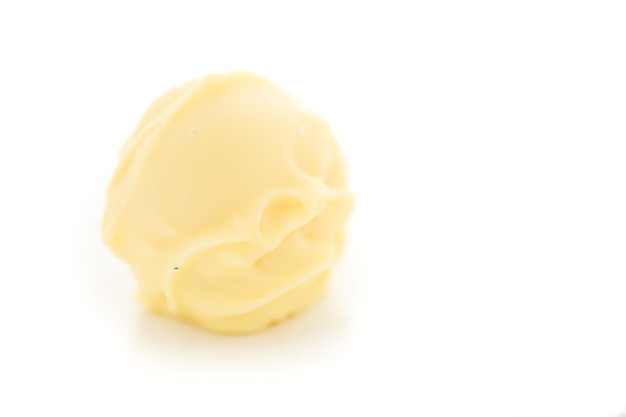 Gourmet white chocolate truffles on a white background.