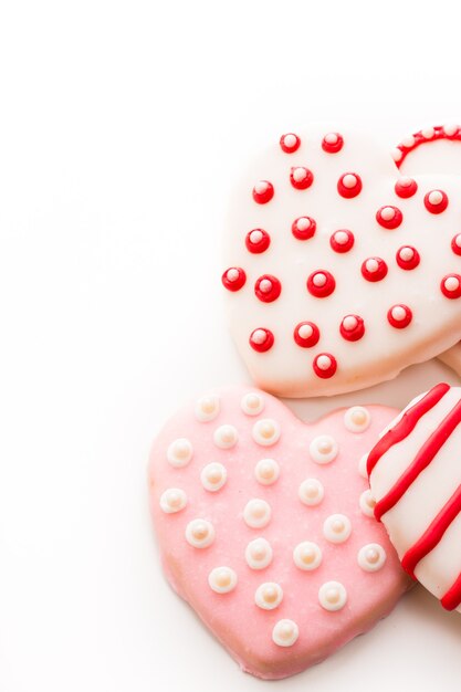 Gourtmet heart shaped cookies decorated for Valentine's Day.