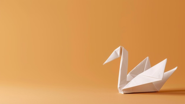 Graceful white origami swan and duck on beige backdrop lit by natural sunlight in a serene setting