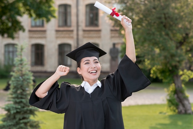 Graduation concept with portrait of happy girl