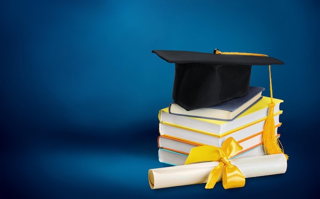 Graduation mortarboard on top of stack of books