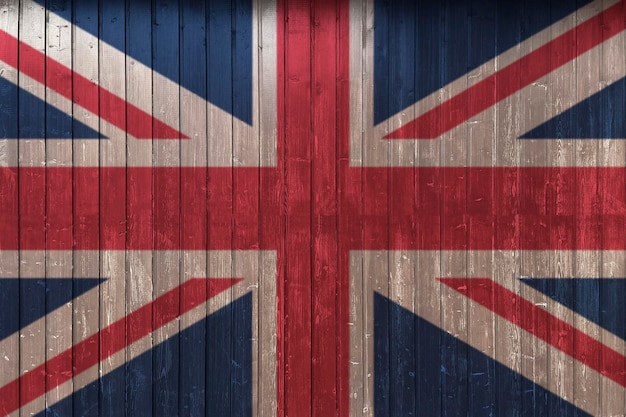 A graffiti of national flag of the Uk painted on the rusty wall