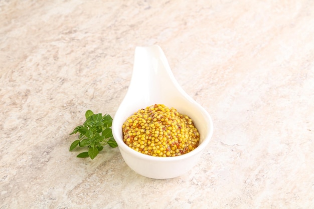 Grain mustard sauce in the bowl