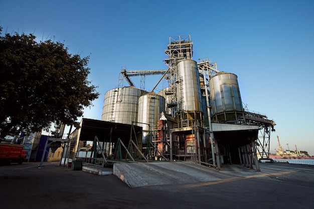 Grain terminal silos at seaport Graindrying elevator storage for agricultural crops with berth