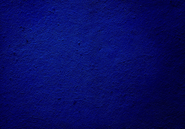 Grained blue wall texture or background