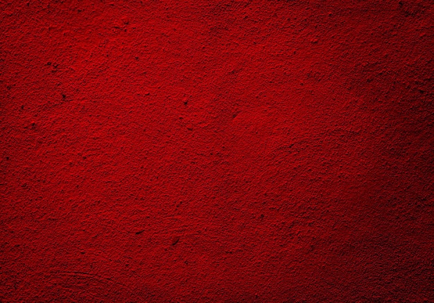 Grained red wall texture or background