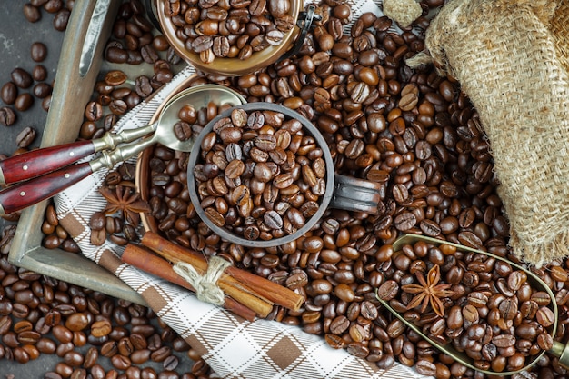 Grains of black coffee on an old background