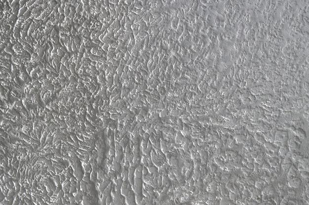 The grainy texture of wall plaster