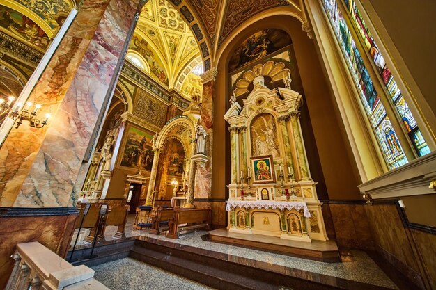 Grand Church Interior with Ornate Altar and Stained Glass Low Angle View