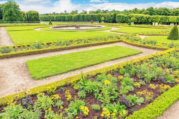 Grand Trianon gardens is famous Frenchstyle gardens “filled with all sorts of orange blossoms green shrubbery