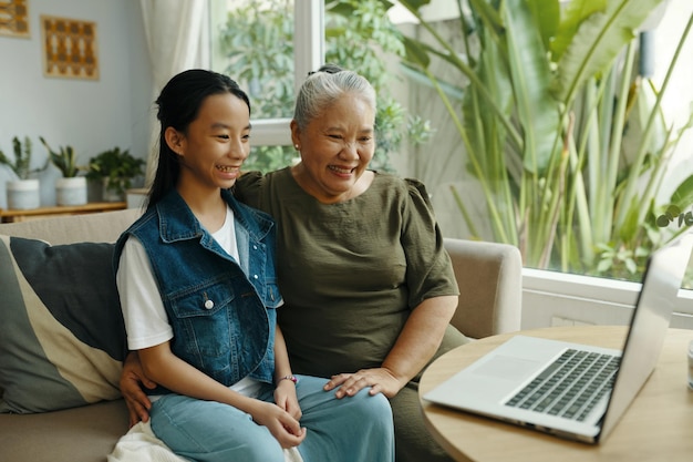 Photo grandma and granddaughter having video call