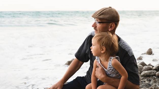 Grandma and grandson looking at sea