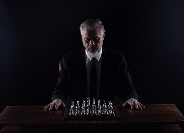 grandmaster in a suit playing chess