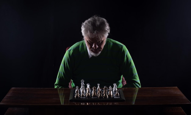 grandmaster in a suit playing chess