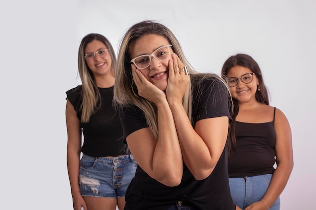 Grandmother mother and daughter wearing eyeglasses in studio photo with white background for clipping