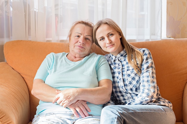 Grandmother sitting on a sofa