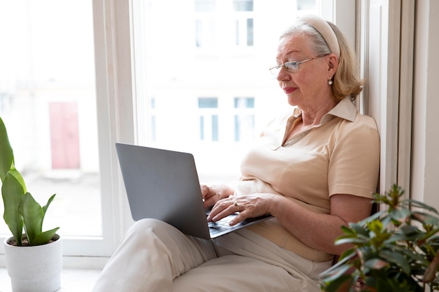 Grandparent learning to use digital device