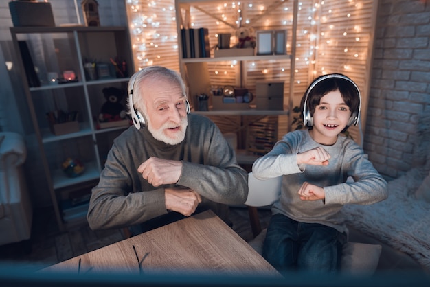 Grandson and Grandpa Listening to Music Headphones