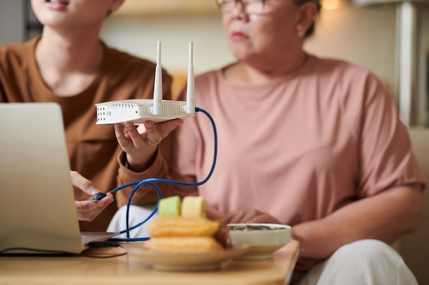 Grandson Setting up WiFi Router