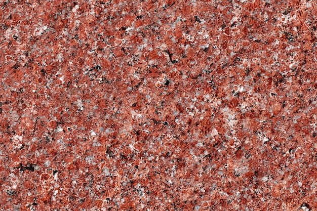 Granite background. Natural stone texture. Red surface. Pattern.