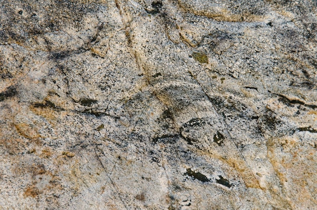 Granite background The wall of the old building Closeup