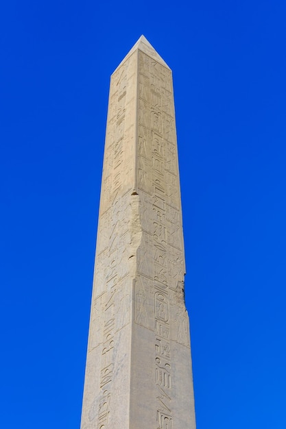 Granite obelisk against blue sky in a Karnak temple Luxor Egypt