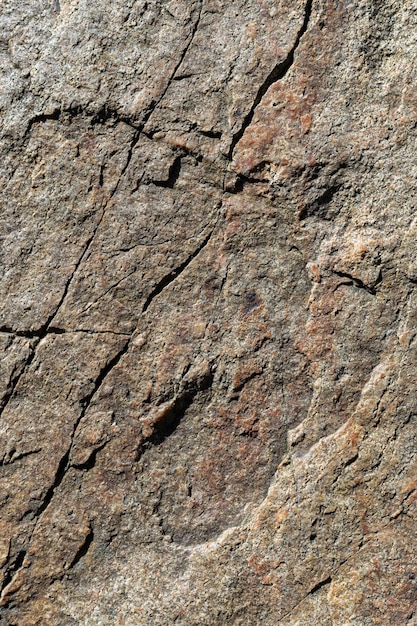 Granite stone texture. Cracked granite rock surface. Natural stone backdrop. Close-up