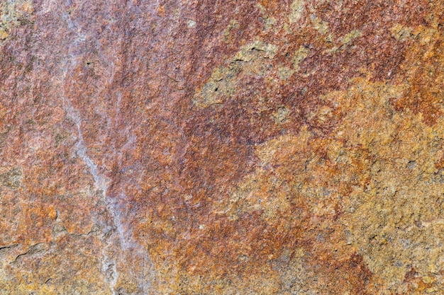 Granite stone texture. Cracked granite rock surface. Natural stone backdrop. Close-up