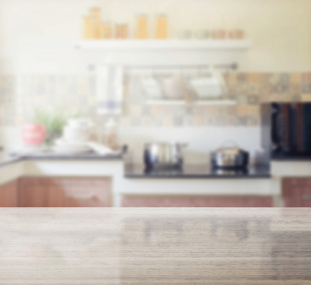 Granite table top and blur of modern kitchen interior as background