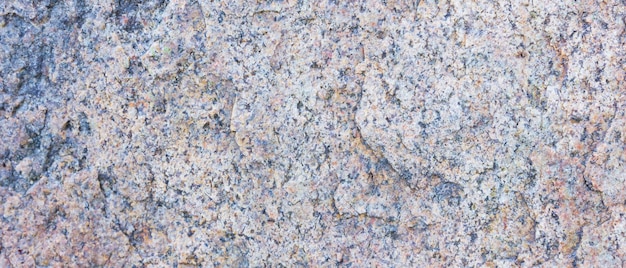 Granite texture Granite rocks with porous surface Background from solid stone