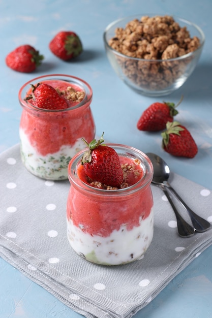 granola crispy with strawberry, spinach, and natural yogurt, a delicious and healthy breakfast 