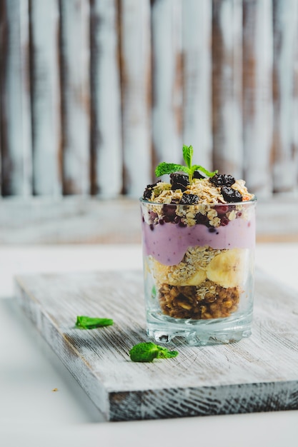 Granola in a glass with yogurt and berries 