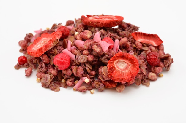 Granola pink muesli with strawberries and red currants chocolate pieces and quinoa seeds