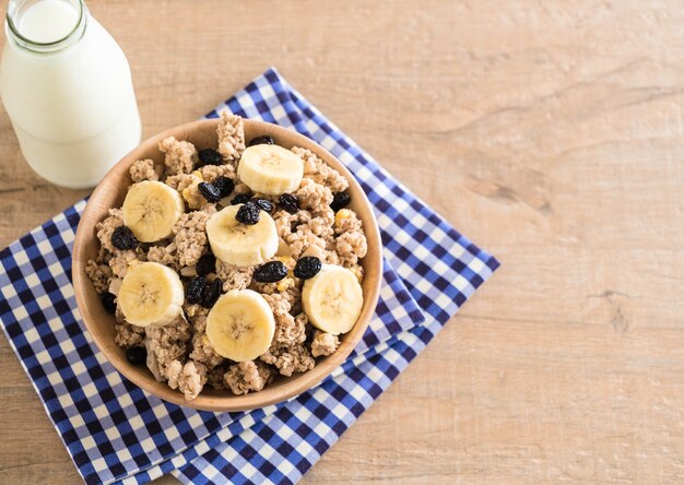 granola with banana, raisin and milk 