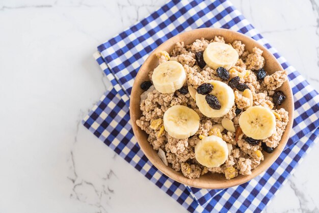 granola with banana, raisin and milk 