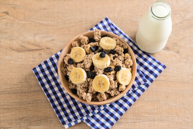 granola with banana, raisin and milk 