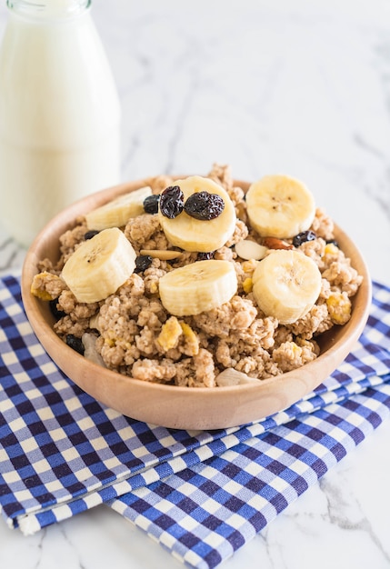 granola with banana, raisin and milk 