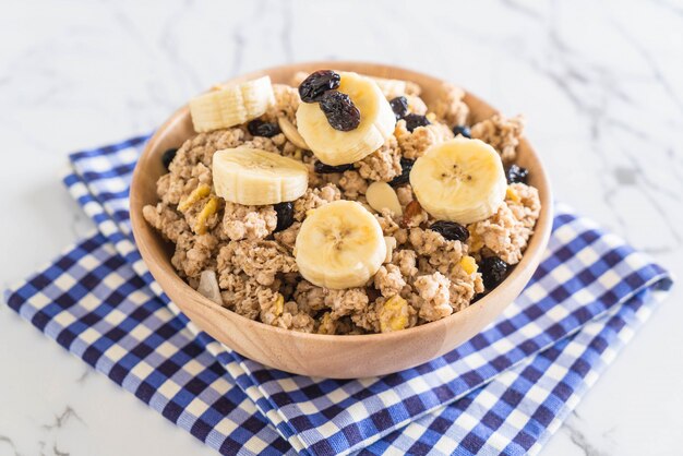 granola with banana, raisin and milk 