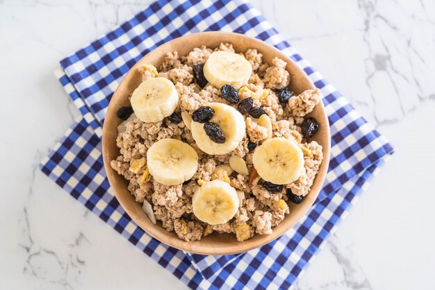 granola with banana, raisin and milk 