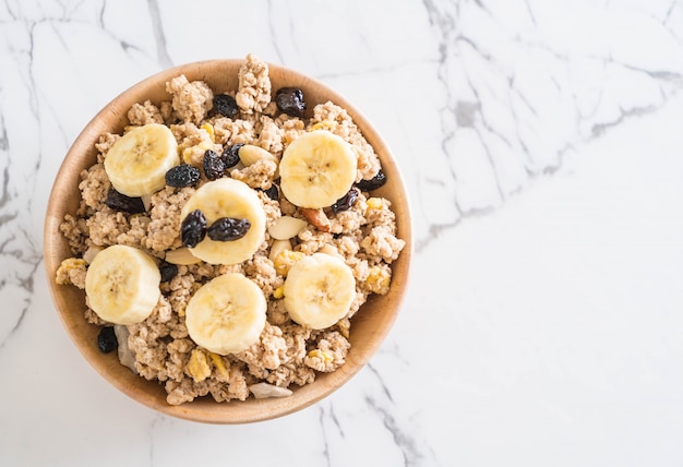 granola with banana, raisin and milk 