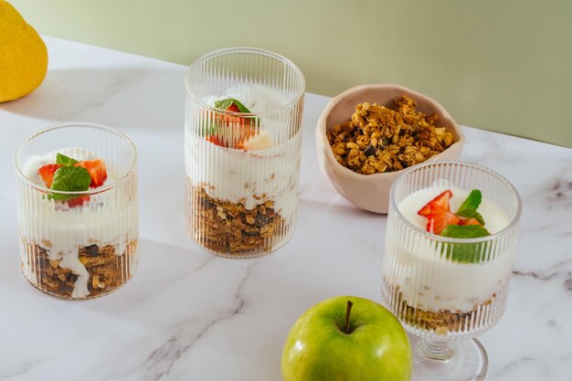 Granola with yogurt nuts and berries in a glass