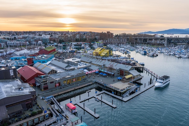 Granville Island Public Market Marina and Fishermen's Wharf Float in dusk Vancouver city buildings