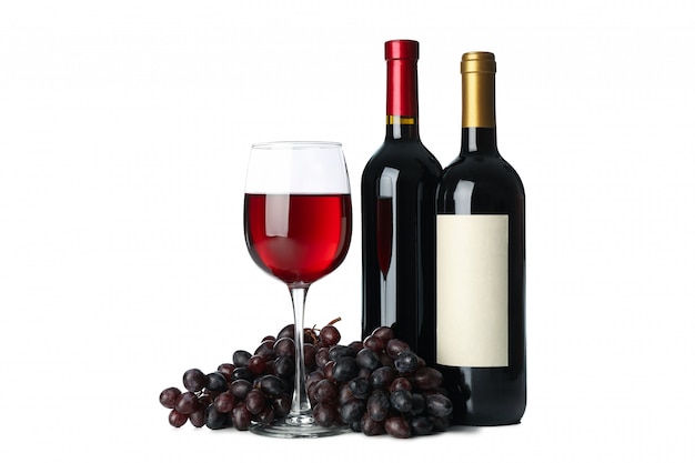 Grape, bottles and glass of wine isolated on white background