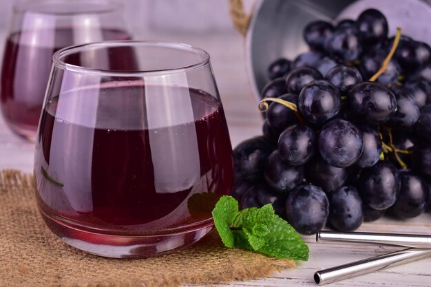 Grape juice from blue grapes.Close-up.