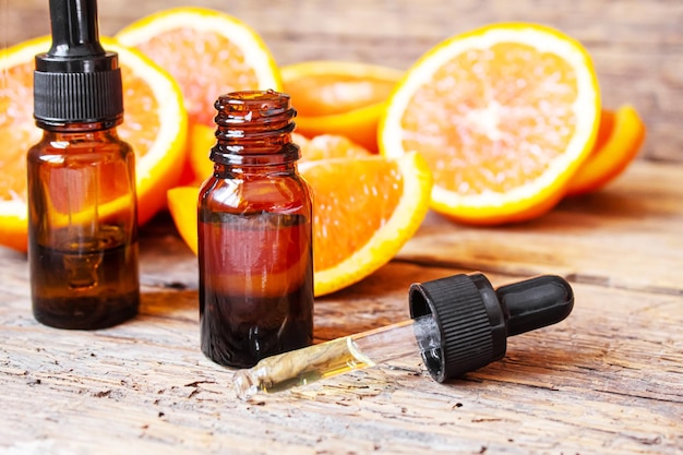 Grapefruit essential oil in a small bottle Selective focus