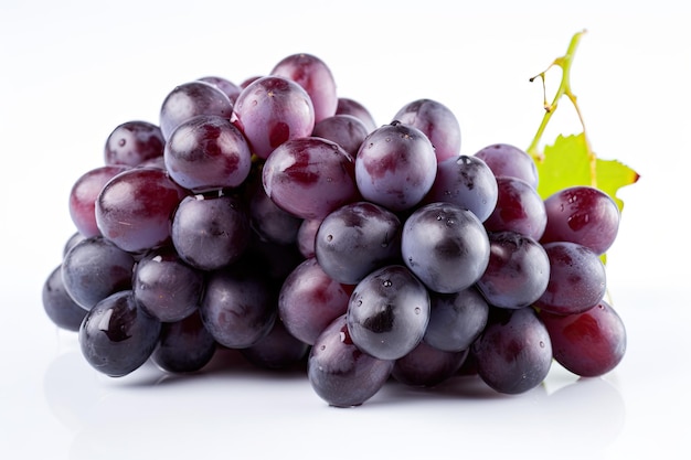 Grapes and a drop of water on a white background