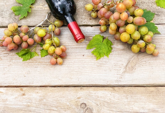 grapes and wine close-up on a wooden background