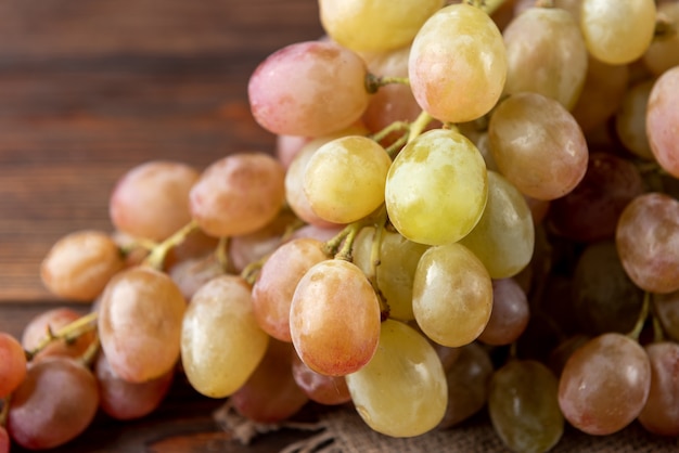 Grapes on wooden table.